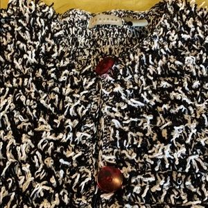 Black and white jacket. Red buttons.  Medium, heavy weight, very cozy!